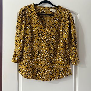 Printed mustard blouse. Half back zip.